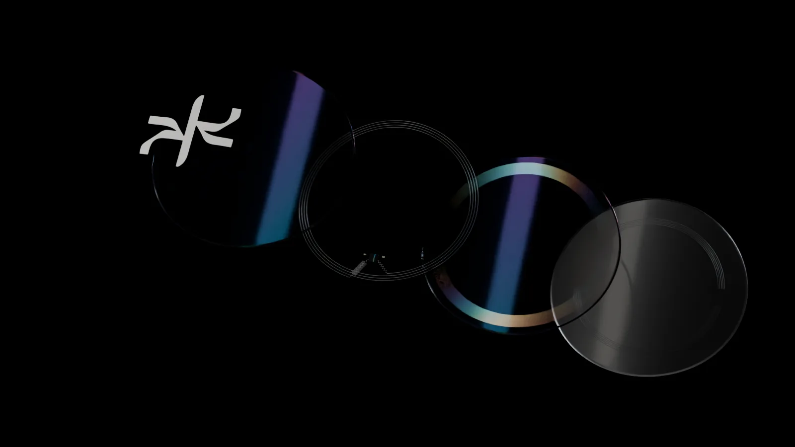 Exploded view of the Dream Wave X.3, five layers on a diagonal: the printed symbol, a clear silk seal, the magnesium circuit with its four-turn antenna and a speck of a chip, a patterned silk film with a rainbow ring under the antenna, and the adhesive face with the fine combs of the sweat cell.